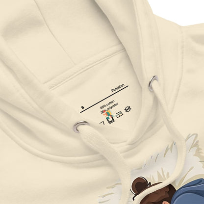 Close-up of a beige hoodie with a label on a white background