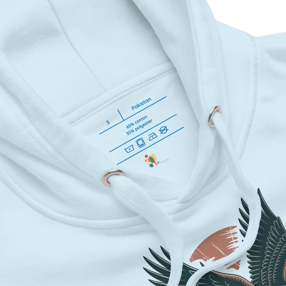 Close-up of a white garment with a label and bird design on a white background