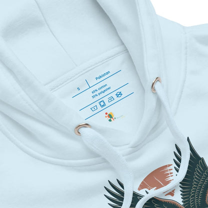 Close-up of a white garment with a label and bird design on a white background
