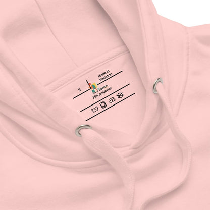 Close-up of a pink hoodie with a label on the chest displaying fabric information.