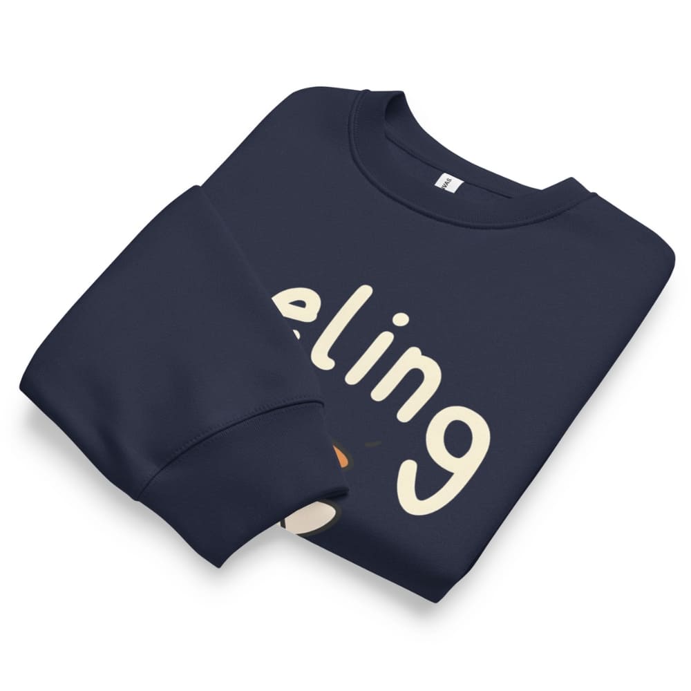 Folded navy blue sweatshirt with 'eling' printed on it against a white background