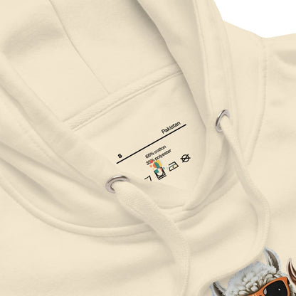 Close-up of a beige hoodie with a label on a white background