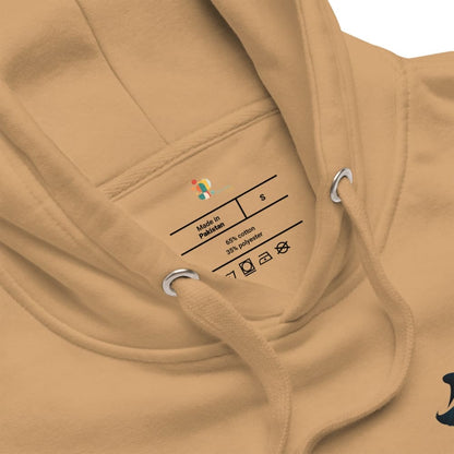 Close-up of a beige hoodie with a label on the chest.