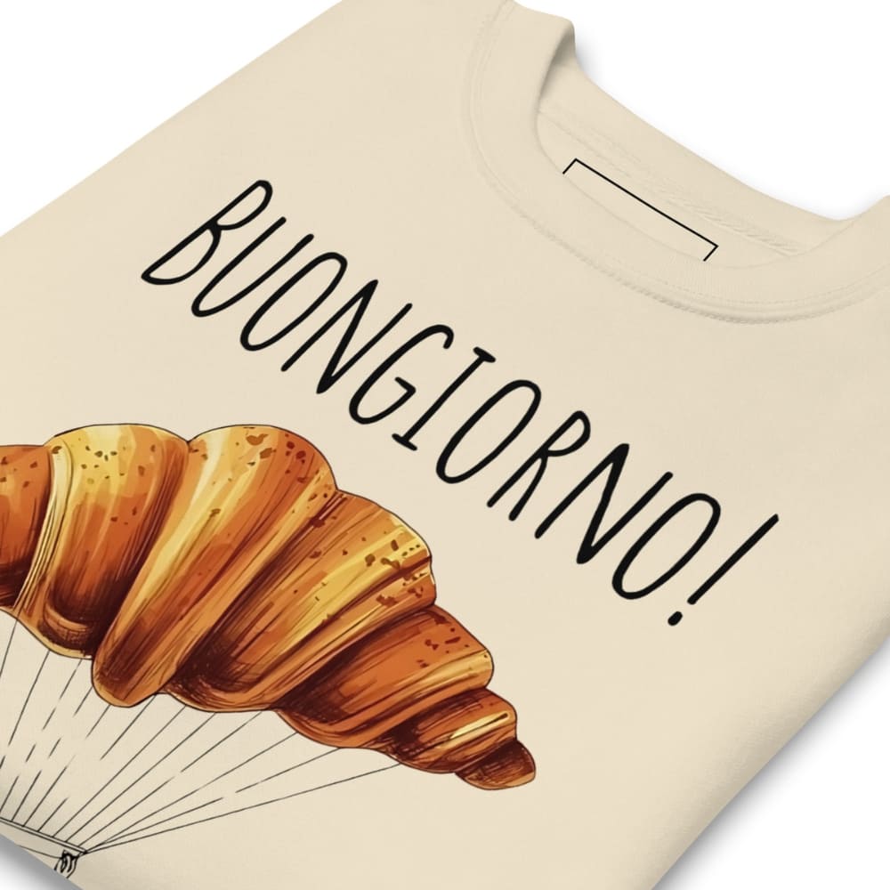 Beige t-shirt with a croissant illustration and 'BUONGIORNO!' text on a white background