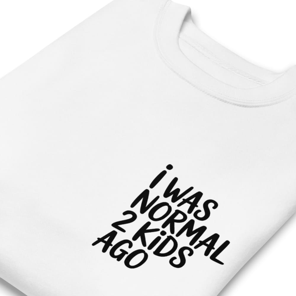 White t-shirt with black text 'I WAS NORMAL 2 KIDS AGO' on a white background
