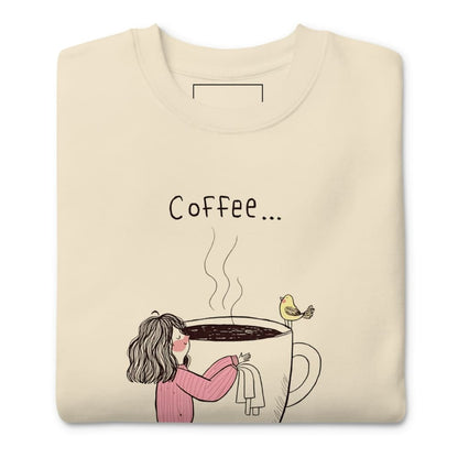 Beige sweatshirt with a coffee-themed graphic and text on a white background