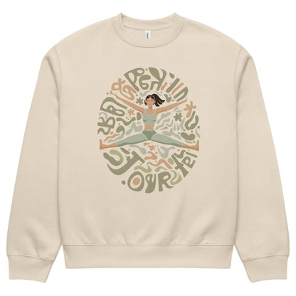 Beige sweatshirt with a graphic of a woman in a yoga pose and text on a white background