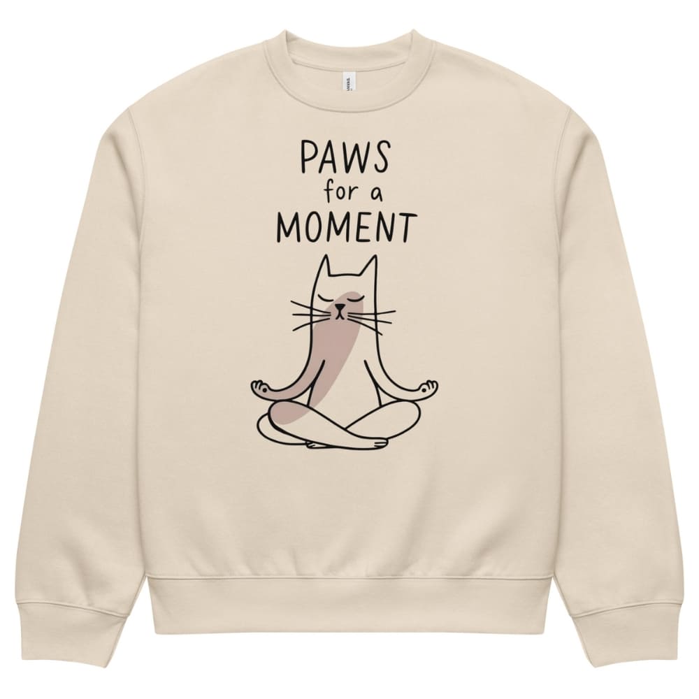Beige sweatshirt with a cat illustration and 'Paws for a Moment' text on a white background