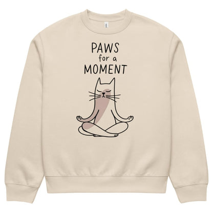 Beige sweatshirt with a cat illustration and 'Paws for a Moment' text on a white background