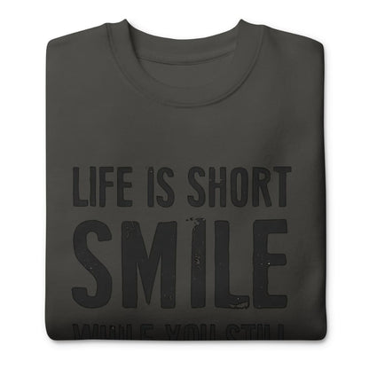 Black t-shirt with 'Life is Short Smile' text on a white background