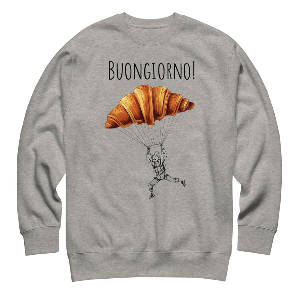 Gray sweatshirt with a cartoon design of a croissant and person parachuting, and 'Buongiorno!' text.