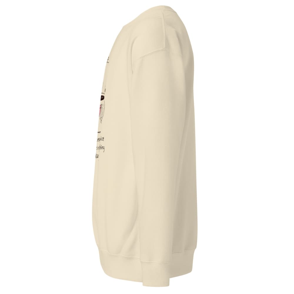 Beige sweatshirt with a small graphic on the sleeve against a white background