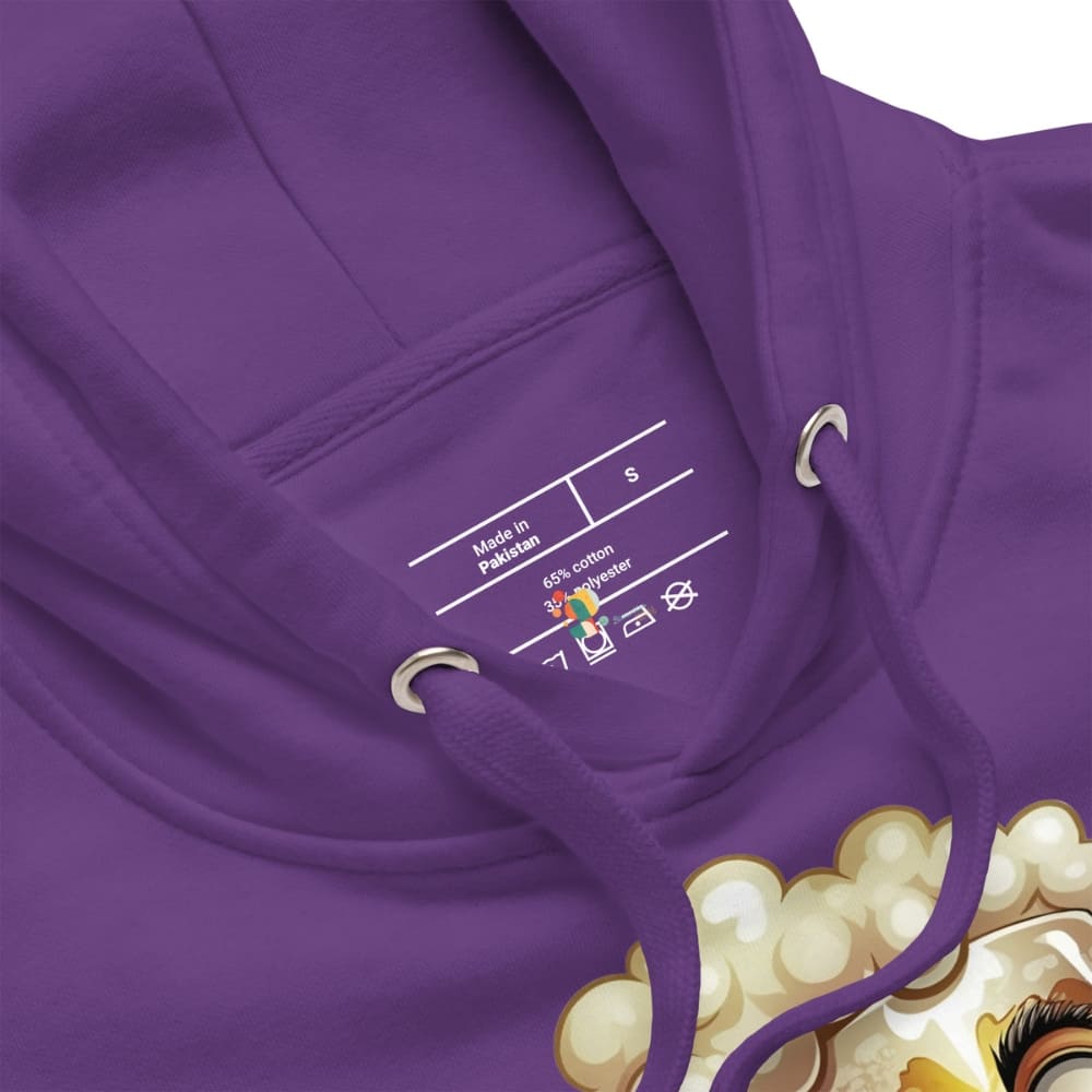 Close-up of a purple hoodie with brand label and part of a design visible.
