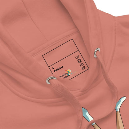 Close-up of a pink hoodie with a label on the chest area.