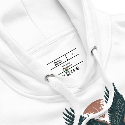 Close-up of a white garment with a label and a design on a white background