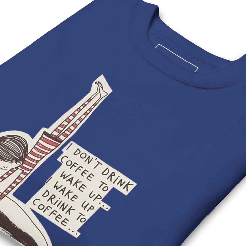 Blue t-shirt with a graphic design featuring text and a person holding a coffee cup.