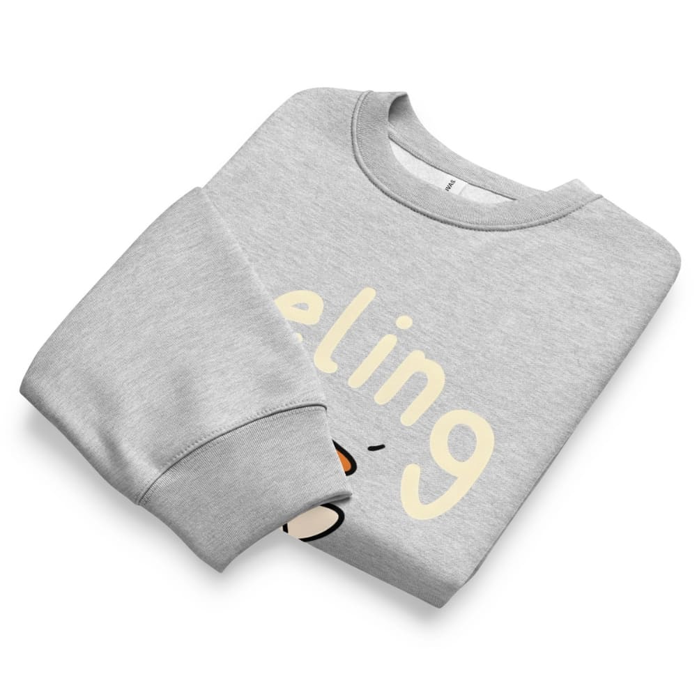Folded gray sweatshirt with yellow text on a white background