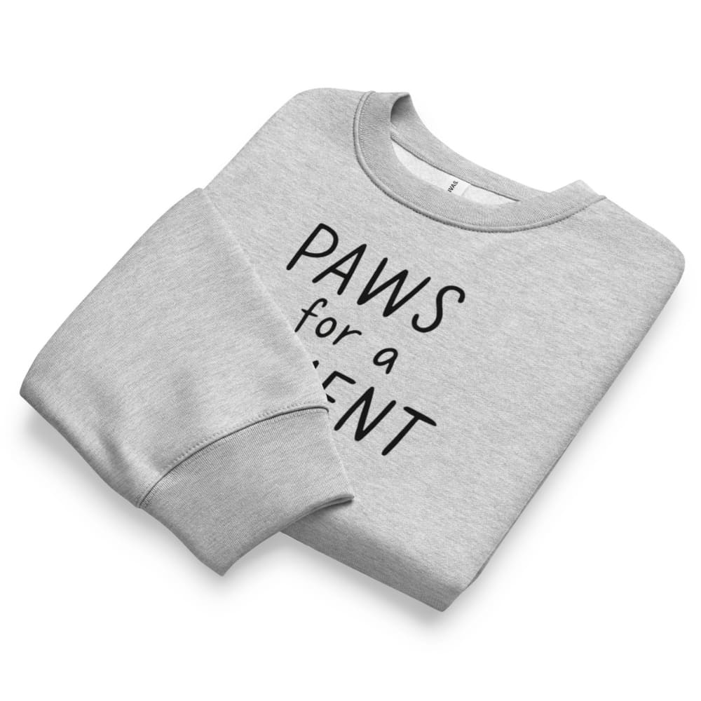 Folded gray sweatshirt with 'PAWS for a PLENT' text on a white background