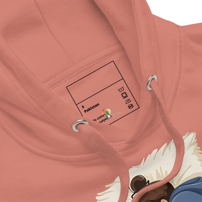 Close-up of a pink hoodie with a label and drawstrings.