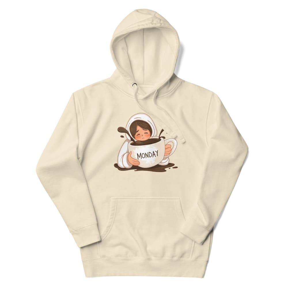 Beige hoodie with a graphic of a person holding a cup labeled 'Monday' on a white background
