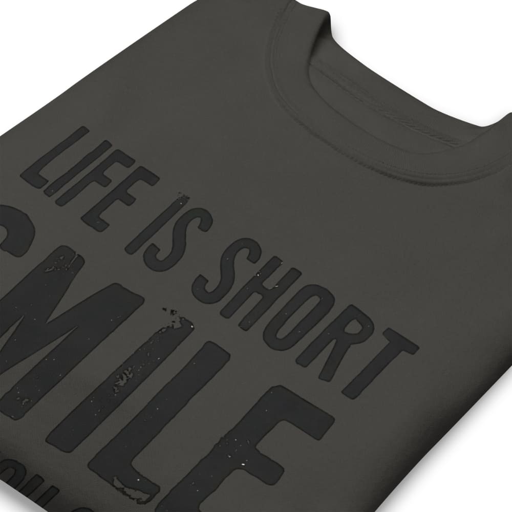 Black t-shirt with 'Life is short, smile' text on a white background