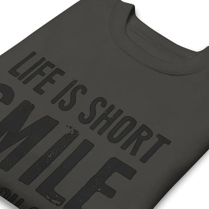 Black t-shirt with 'Life is short, smile' text on a white background