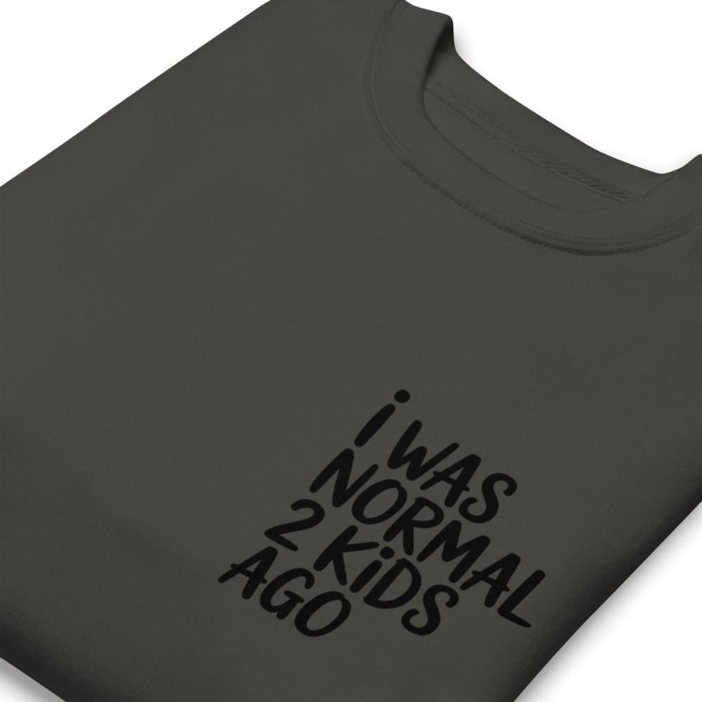Black t-shirt with text 'I WAS NORMAL 2 KIDS AGO' on a white background