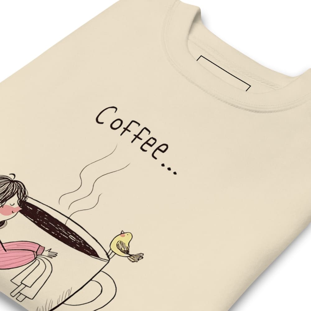 Beige t-shirt with a graphic of a person holding a coffee cup and a bird, with the word 'Coffee' above.