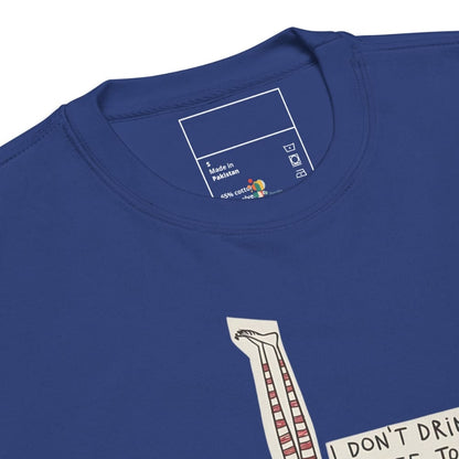 Close-up of a blue t-shirt with a graphic design and label on the collar.