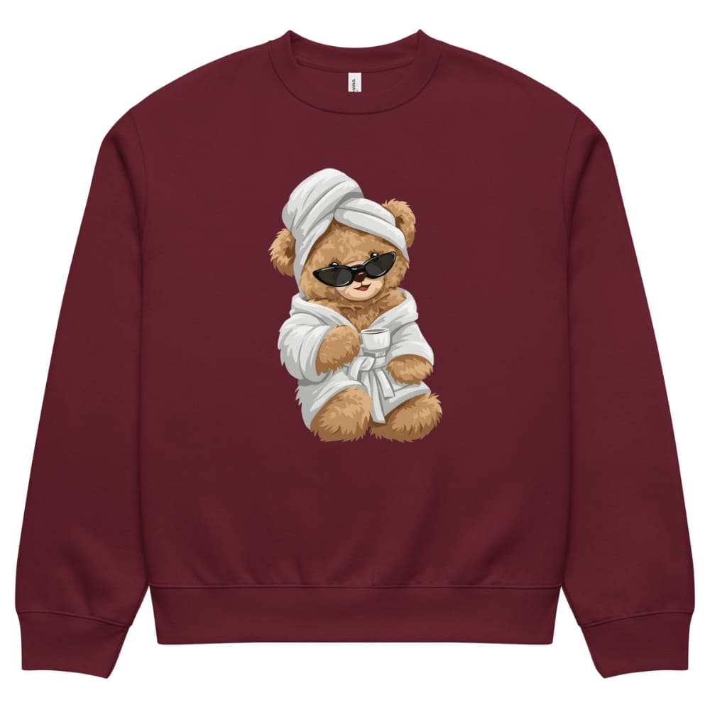 Maroon sweatshirt with a teddy bear design wearing sunglasses, a towel, and a robe on a white background.
