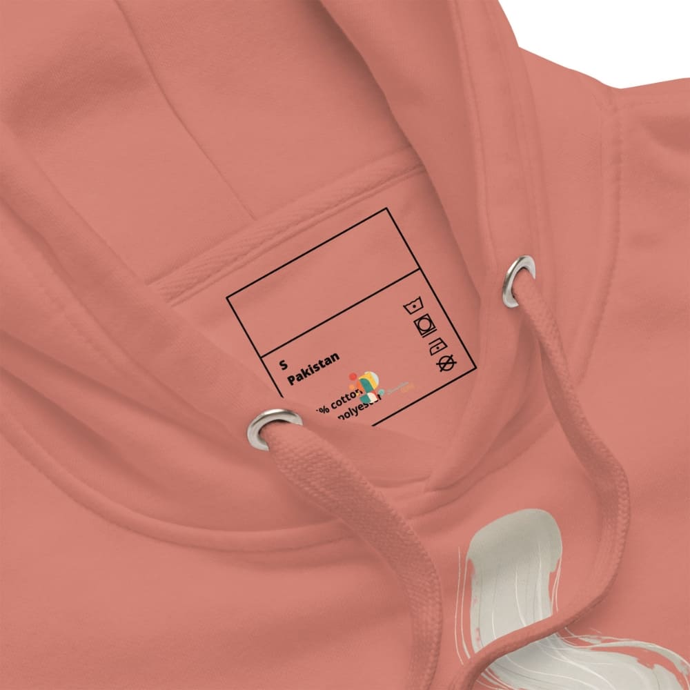 Close-up of a pink hoodie with a label on the chest area.