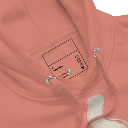 Close-up of a pink hoodie with a label on the chest area.