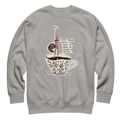 Gray sweatshirt with a coffee-themed graphic design on a white background
