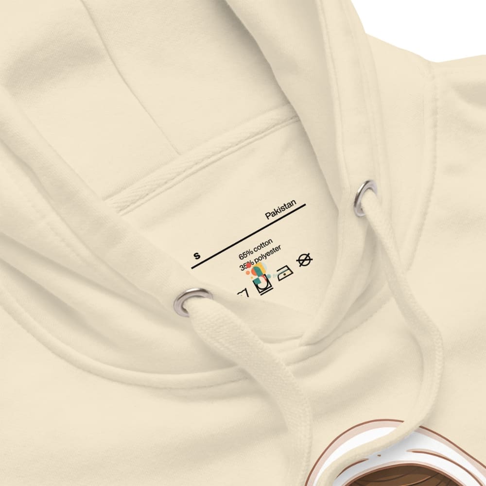 Close-up of a beige garment with a label on a white background