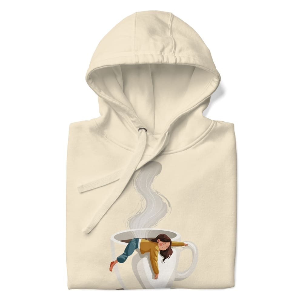 Beige hoodie with a graphic of a person in a coffee cup on a white background