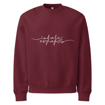Maroon sweatshirt with 'inhale exhale' text on a white background