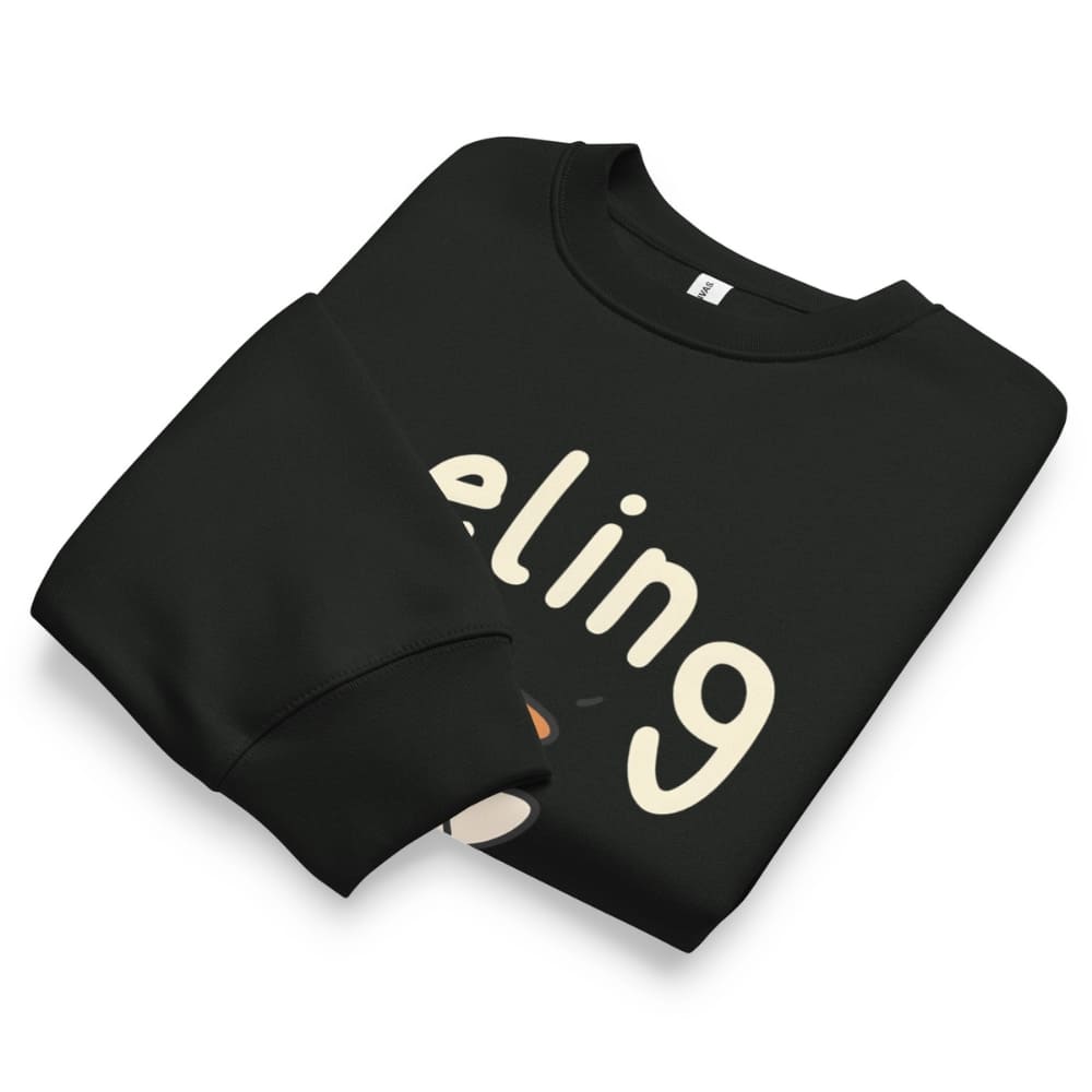 Black sweatshirt with 'eling' printed on it, folded neatly on a white background