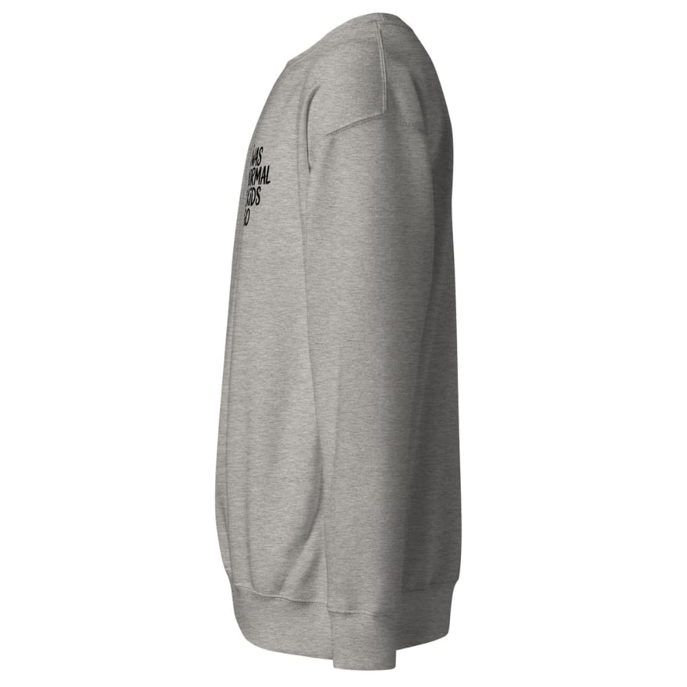 Gray sweatshirt with a brand logo on the sleeve against a white background
