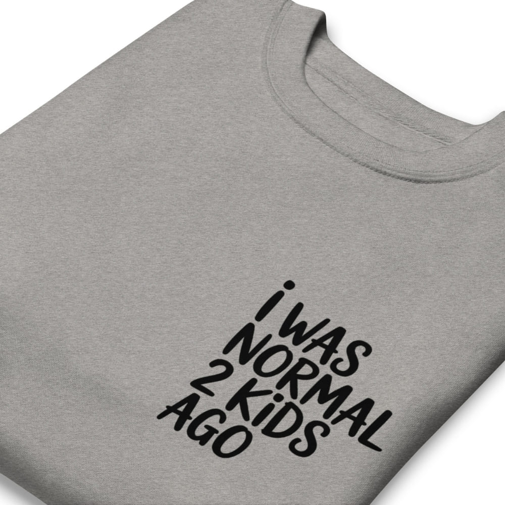 Gray t-shirt with black text 'I WAS NORMAL 2 KIDS AGO' on a white background