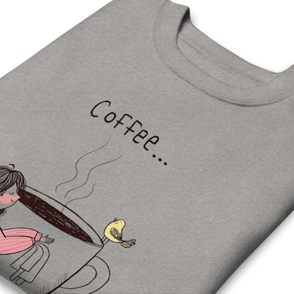 Gray t-shirt with a graphic of a person holding a coffee cup and the word 'Coffee...' on a white background.