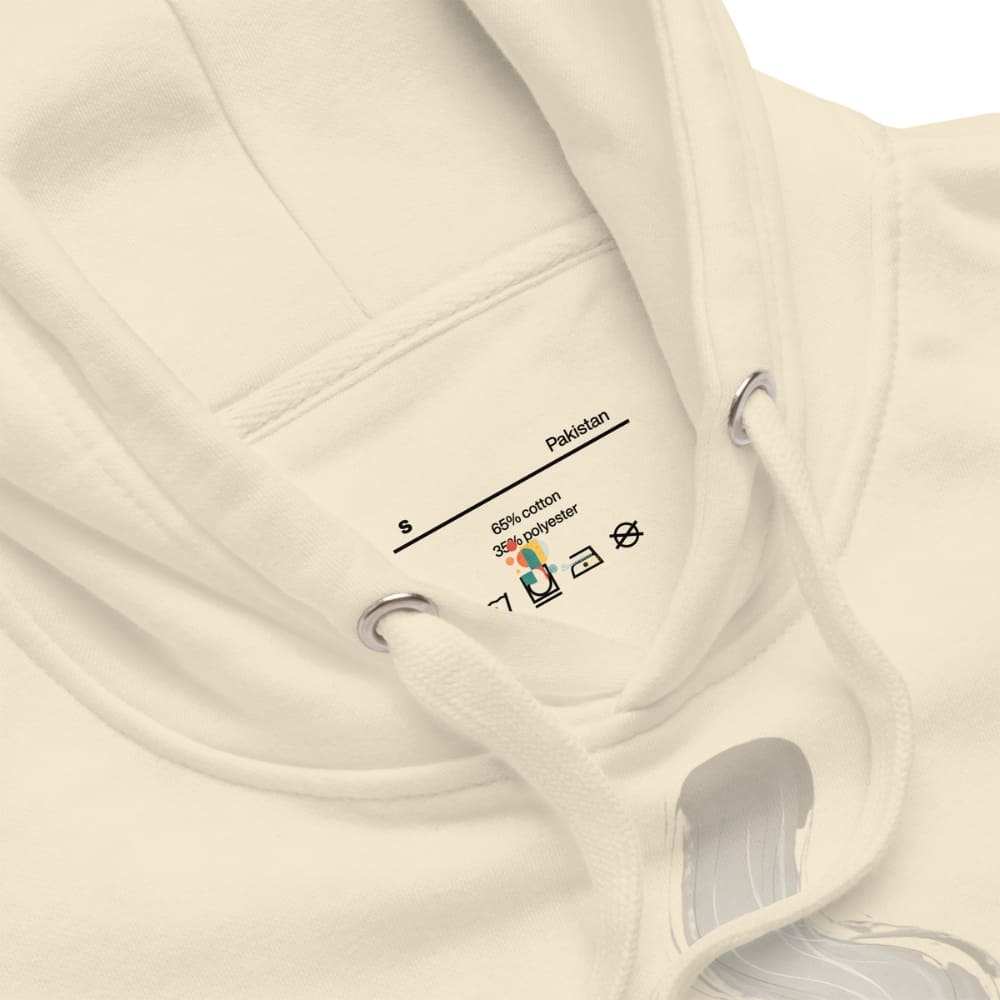 Beige hoodie with a visible tag on a white background