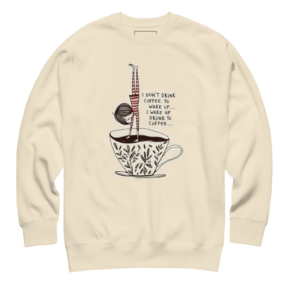 Beige sweatshirt with a coffee-themed graphic and text on a white background