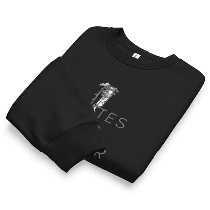 Folded black sweatshirt with white text and graphics on a white background