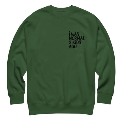Green sweatshirt with text 'I WAS NORMAL 2 KIDS AGO' on a white background