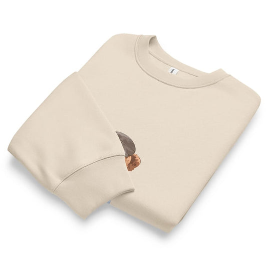 Beige sweatshirt with a small graphic on a white background