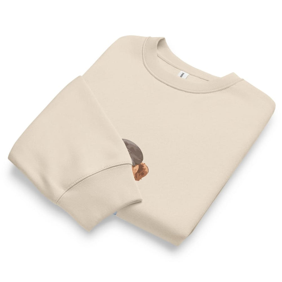 Beige sweatshirt with a small graphic on a white background