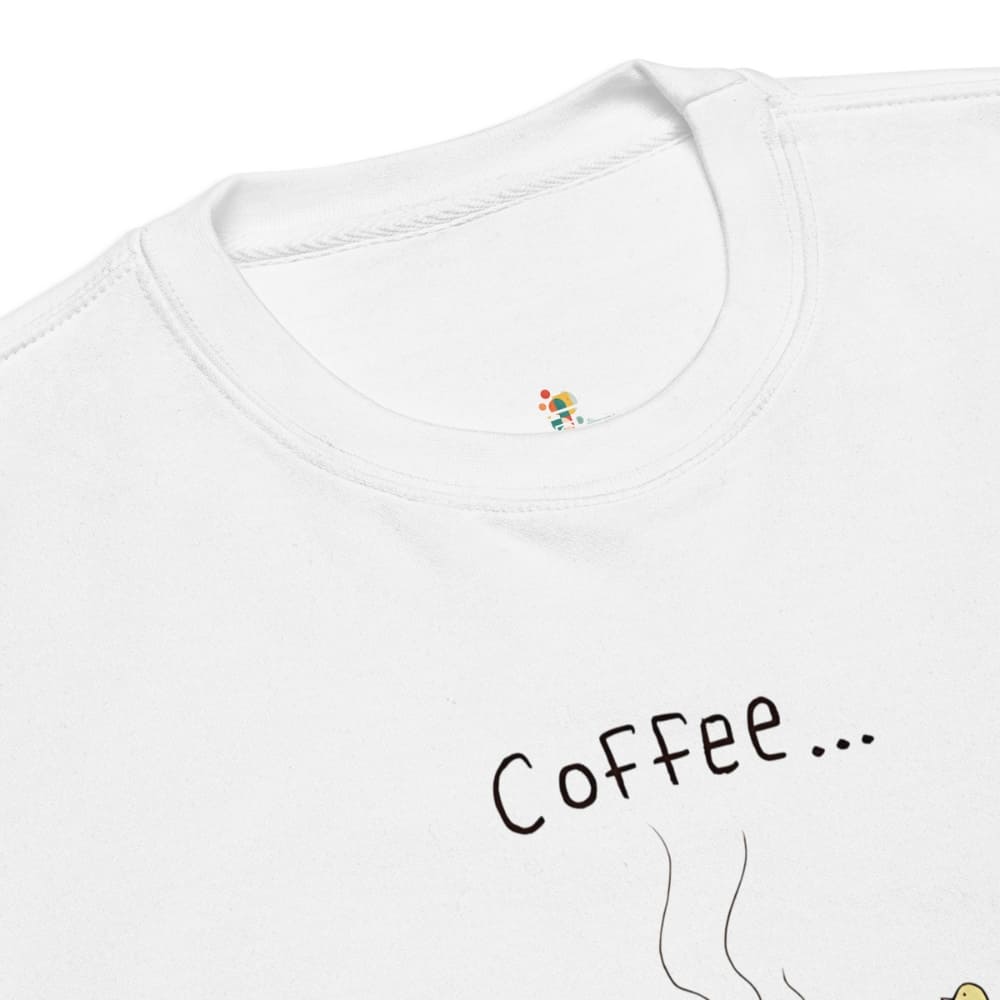 White t-shirt with 'Coffee...' text and colorful design on a white background