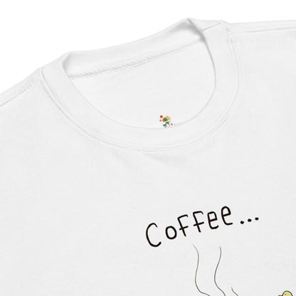 White t-shirt with 'Coffee...' text and colorful design on a white background
