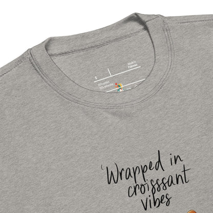 Gray t-shirt with 'Wrapped in croissant vibes' text and brand label.
