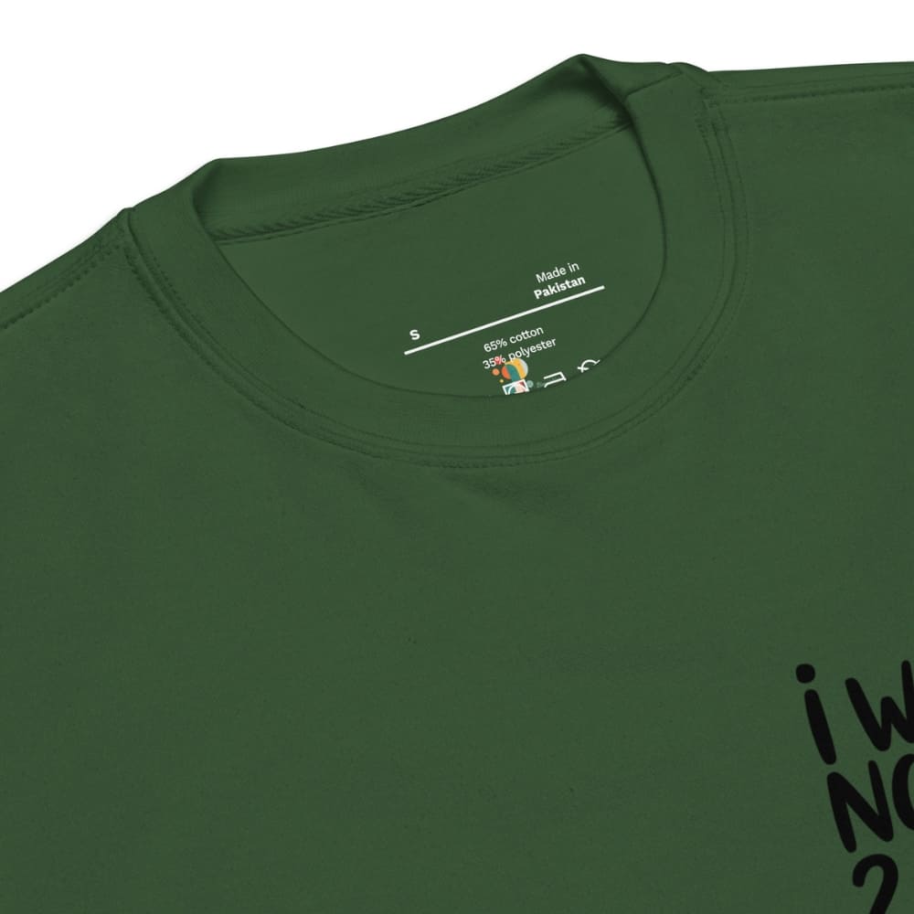 Green t-shirt with 'Made in Pakistan' label on the collar